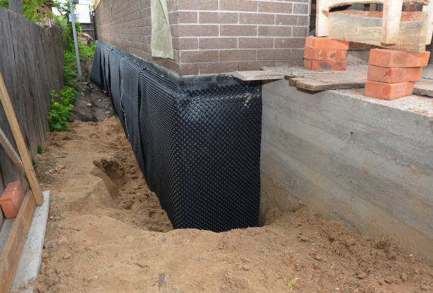 Happy homeowners after waterproofing job in Omro